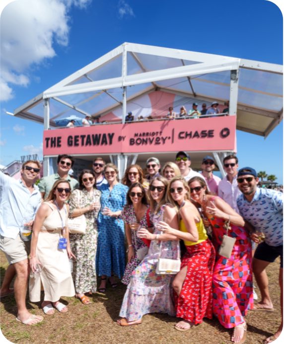 A crowd poses in front of The Getaway presented by Marriott Bonvoy and Chase at the Charleston Wine + Food Festival 