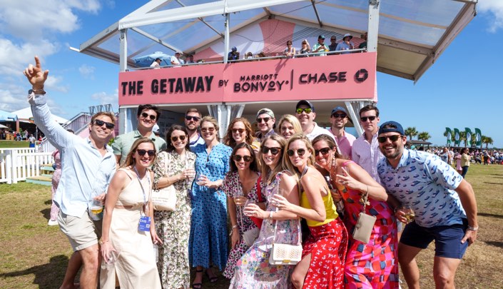 A crowd poses in front of The Getaway presented by Marriott Bonvoy and Chase at the Charleston Wine + Food Festival 