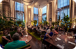 A wide-angle view of Marriott Bonvoy Cardmembers seated throughout the Lilac