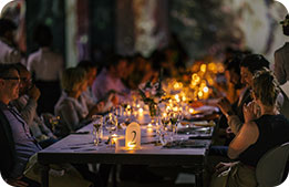 Marriott Bonvoy Cardmembers seated for dinner during the Hall des Lumières Immersive Art & Dining Experience