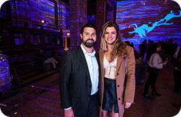 Guests pose for a photo during the Hall des Lumières Immersive Art & Dining Experience