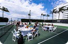 Marriott Bonvoy Cardmembers enjoying on-court refreshments on the W South Beach's outdoor basketball court