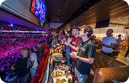 Marriott Bonvoy Cardmembers watch the Miami Heat play from the Bacardi Ocho lounge