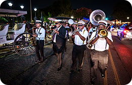 A Second Line parade escorting guests to Preservation Hall