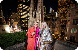 Cardmembers enjoy holiday lights on the patio with St. Patrick's Cathedral in the background