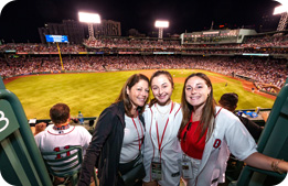 Marriott Bonvoy Cardmembers pose for a photo under Fenway Park's bright lights