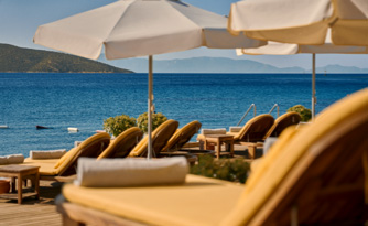 Loungers and umbrellas next to the sea