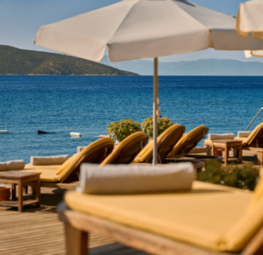 Loungers and umbrellas next to the sea