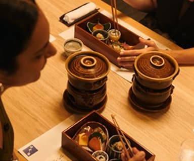 A woman looking down at her food