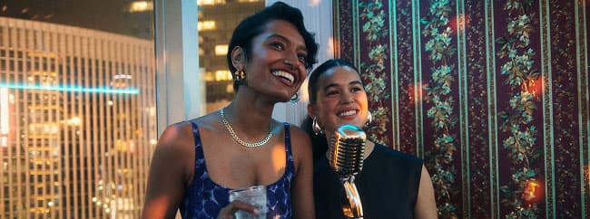 Two people performing karaoke in Japan.