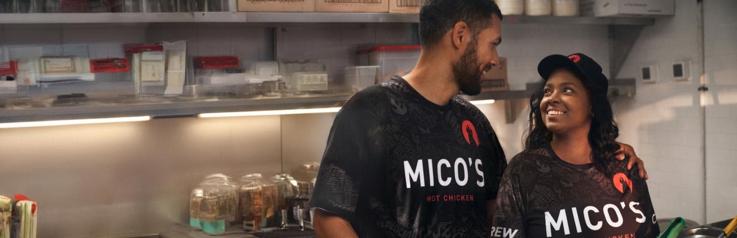 Workers looking at eachother in the kitchen