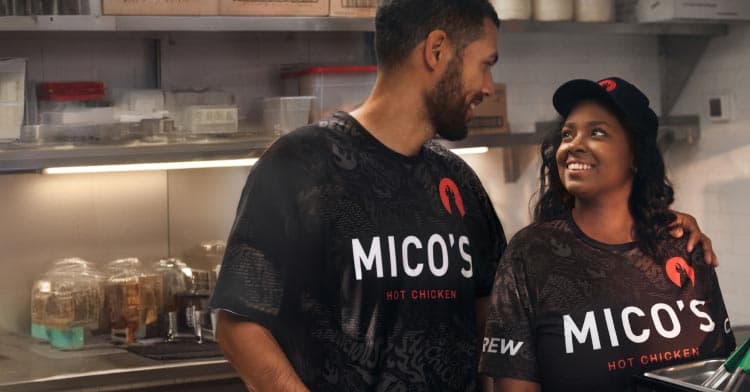 Workers looking at eachother in the kitchen