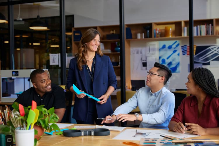 A woman smiling at her students