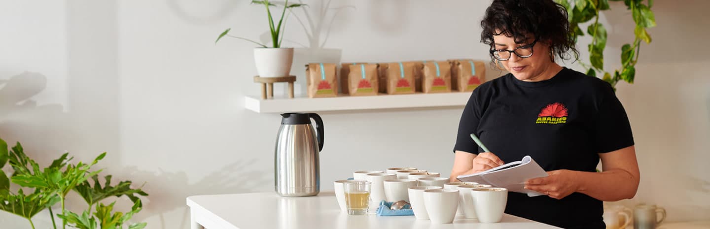 A woman writing in a notebook