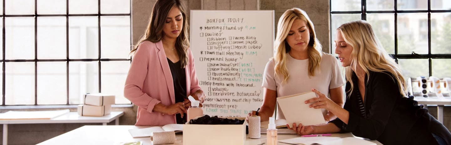 3 women looking down
