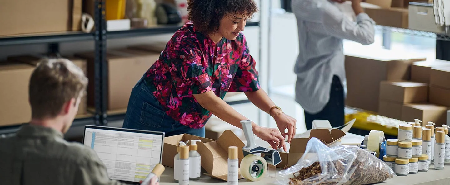 A woman packaging up her supplies