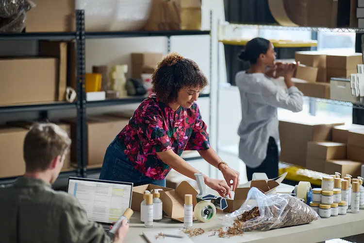A woman packaging up her supplies