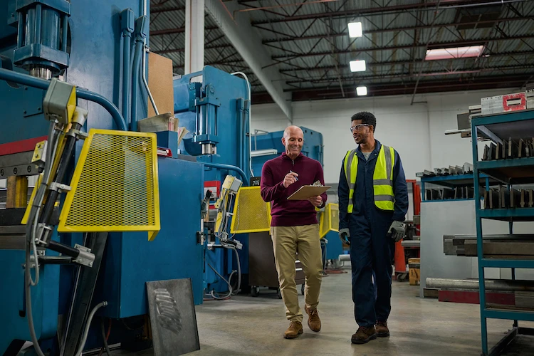 Coworkers checking off a list