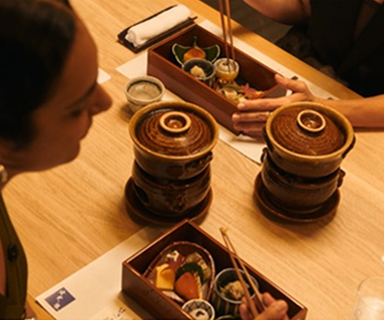 A woman looking down at her food