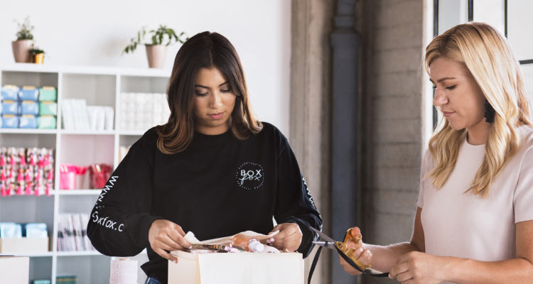 2 women looking down