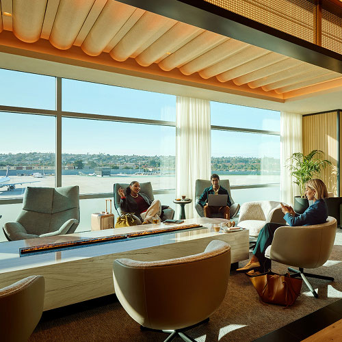 Two women and one man sitting in a lounge