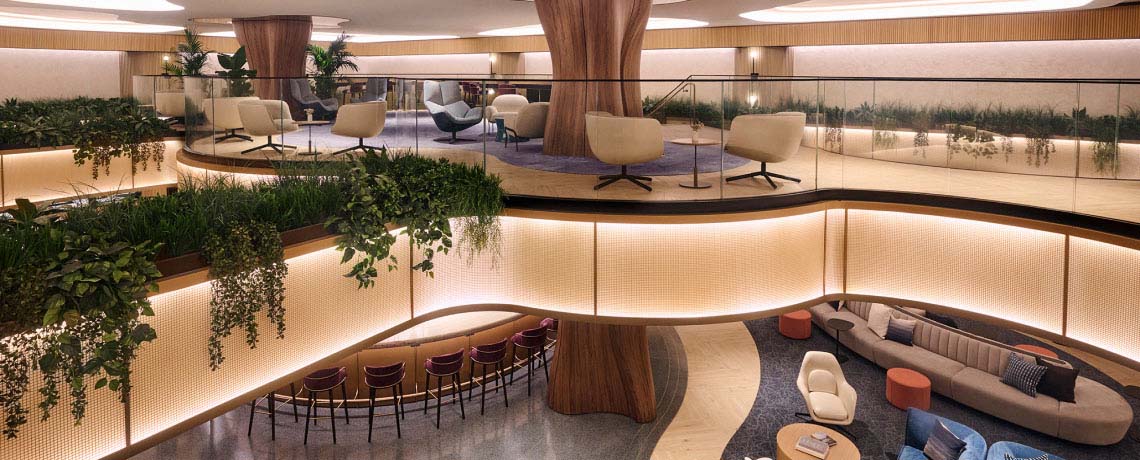 Sapphire Lounge at LaGuardia Airport, New York, with a circular bar counter, high stools, and warm lighting.