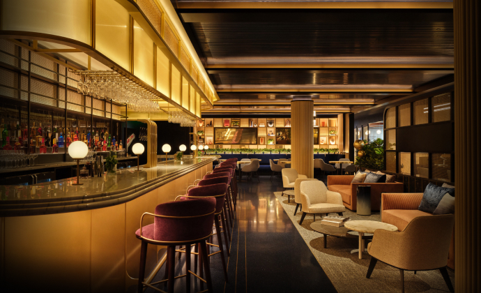 Sapphire Lounge at Philadelphia International Airport with a long bar counter, high chairs, elegant lighting, and plush seating areas.