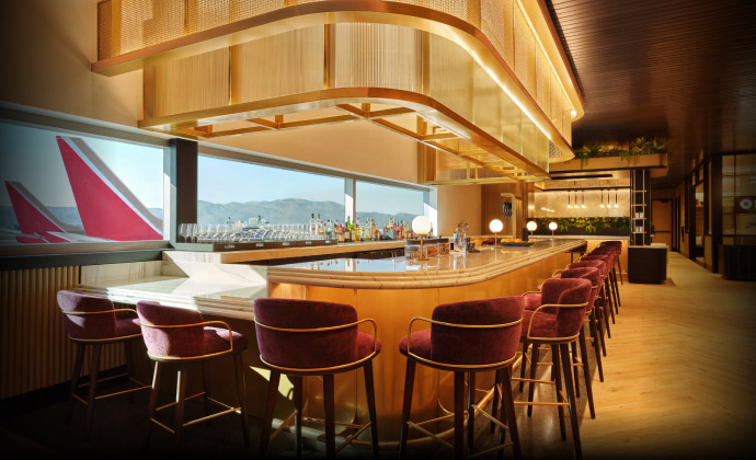 Sapphire Lounge at Phoenix Sky Harbor International Airport with a curved bar counter, purple stools, and large windows with runway views.