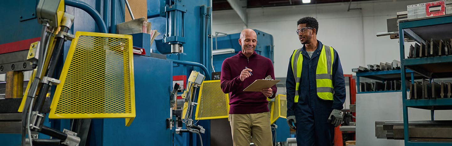 Lady in blue smiling at the camera