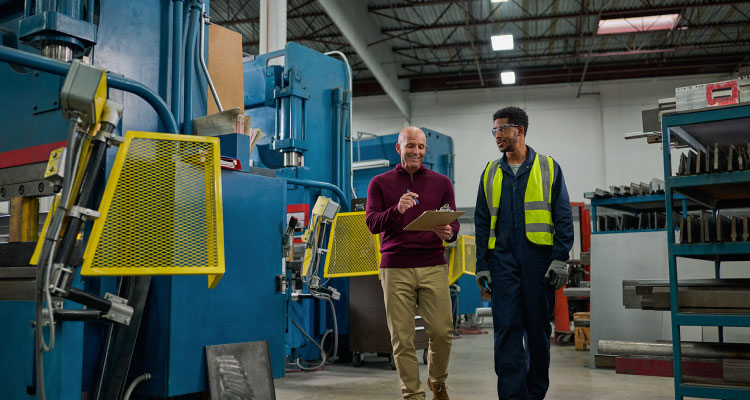 Lady in blue smiling at the camera