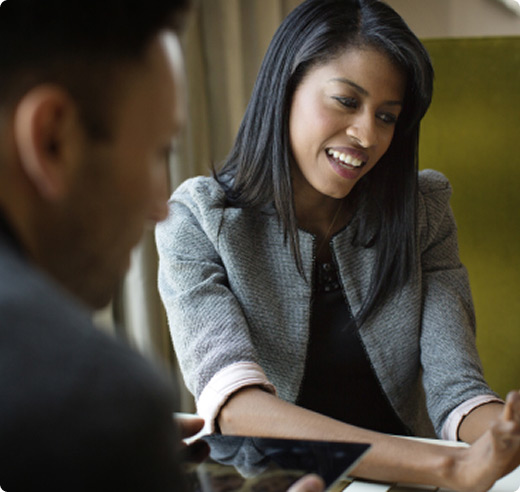 Partners reviewing cash flow projections on their business tablet