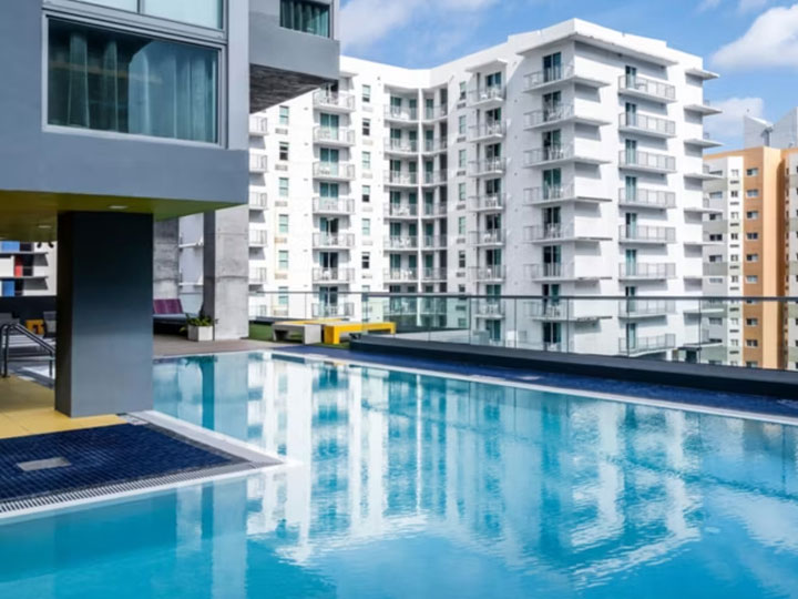 Outdoor pool at Atwell Suites Miami Brickell surrounded by city buildings