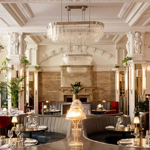 Restaurant dining room with chandelier lighting at Kimpton Fitzroy London
