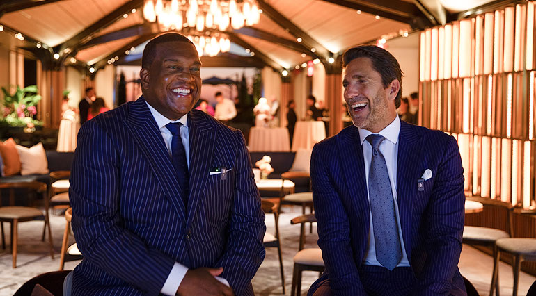 Henrik Lundqvist and Kev Weekes are seated at a VIP hockey kickoff event in New York, exclusively for Chase and Aeroplan members