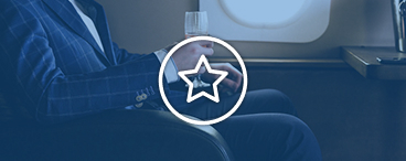 Passenger seated by an airplane window, representing booking upgrades with Avios.