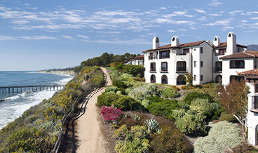 Oceanfront coastal estate along a cliffside path