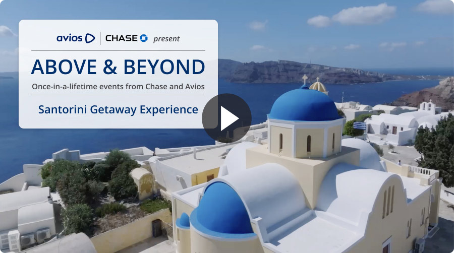 White buildings with blue domes overlooking the sea in Santorini