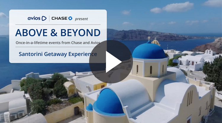 White buildings with blue domes overlooking the sea in Santorini