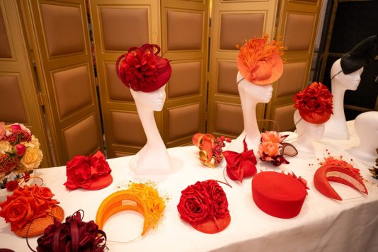 Red floral fascinators on display