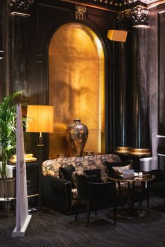 Hotel lobby seating area with large vase
