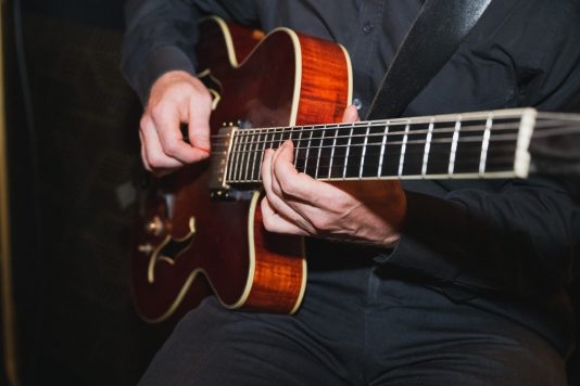 Musician playing jazz guitar