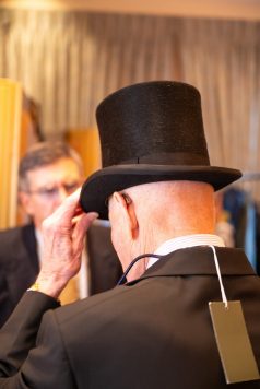 Guest trying on a top hat