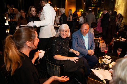 Guests chatting in lounge seating area