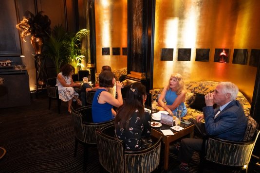 Guests seated in event lounge