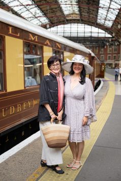 Guests gathered by vintage British Pullman