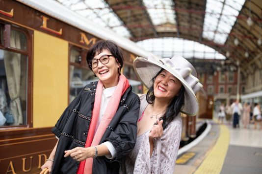 Attendees near British Pullman carriage