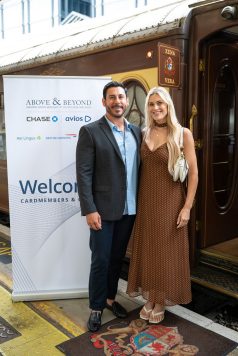 Guests posing at event welcome sign