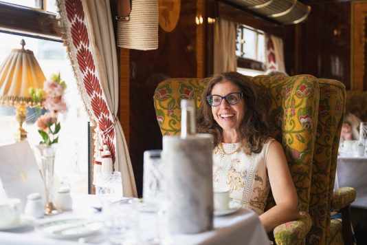 Guest seated in train dining car