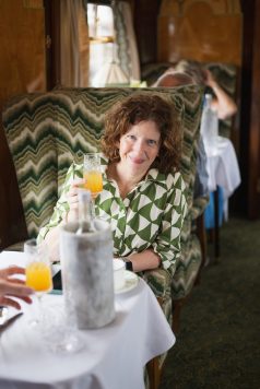 Passenger seated in train cabin