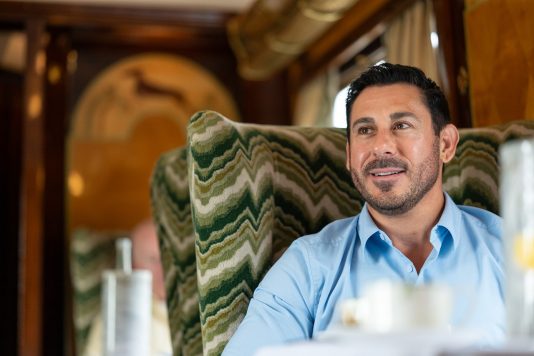 Guest seated aboard luxury train